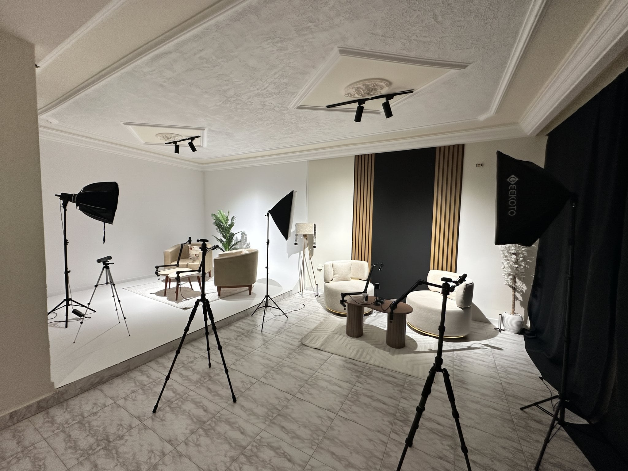 The whole Tunisia Studios room: two podcast sets, softbox lights and cameras on tripods